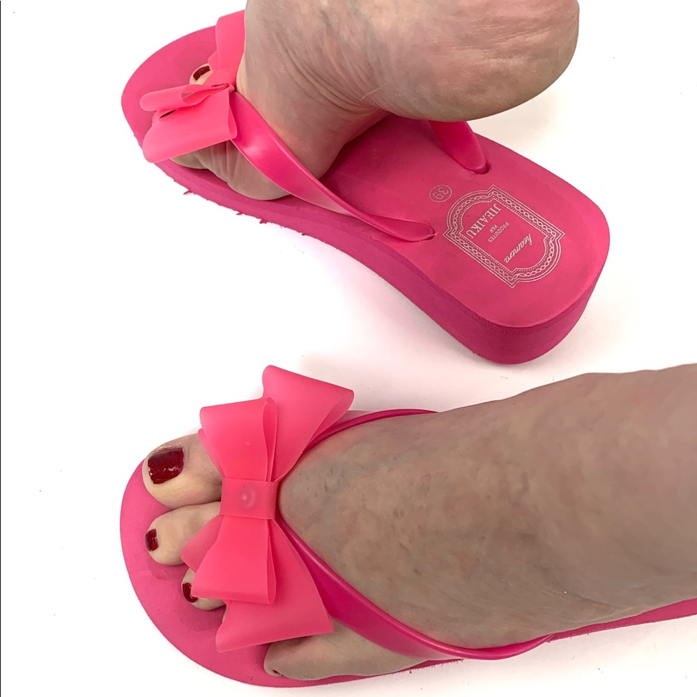 Hot pink platform flip-flops